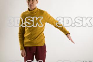 Arm flexing reference of yellow sweater red trousers Sidney 0002